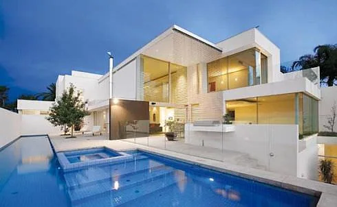 House exterior beside a swimming pool